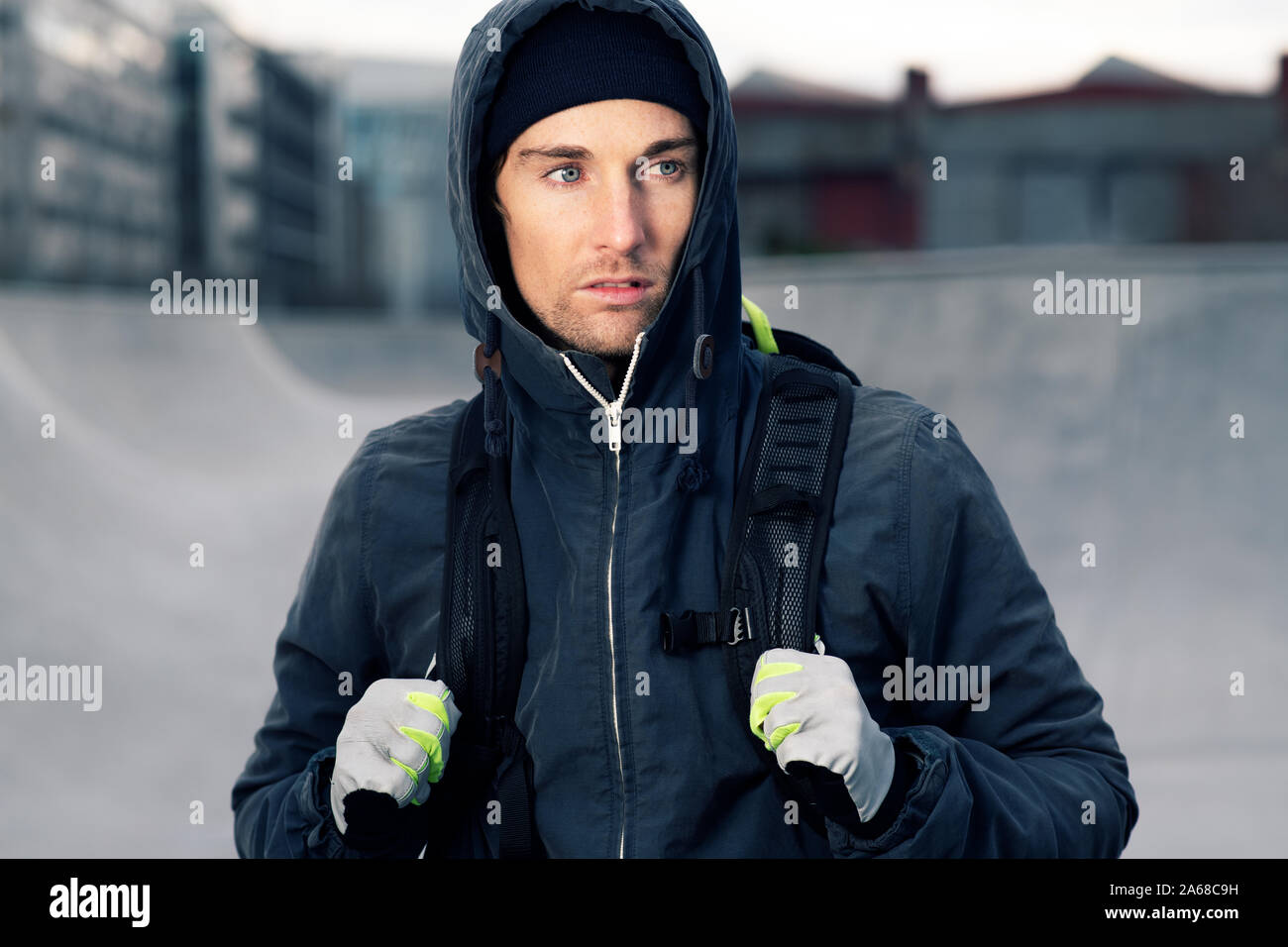 Portrait of a young attractive man wearing a hooded jacket Stock Photo
