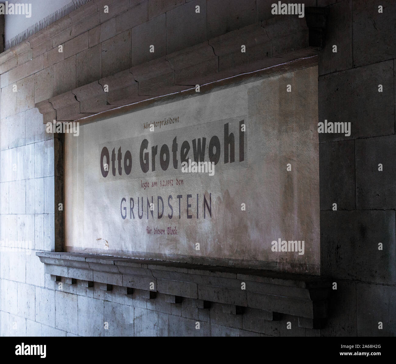 Memorial sign for Otto Grotewohl with foundation stone of construction of worker's resident blocks at Karl Marx avenue (former Stalin avenue), Berlin Stock Photo