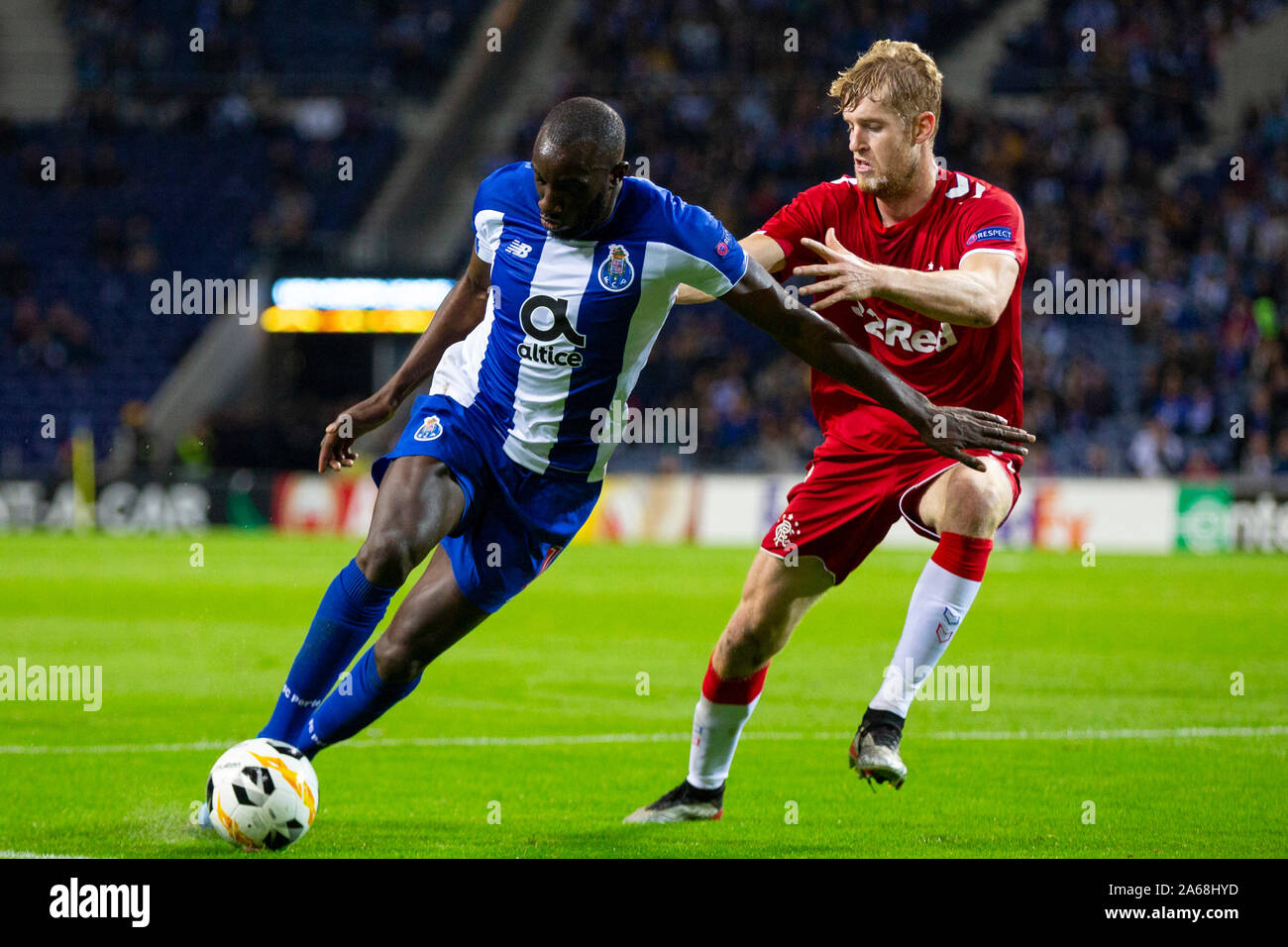 FC Porto's player, Moussa Marega (L) and Ranger's player, Filip Helander (R) are seen in action during the UEFA Europa League match at Dragon Stadium. (Final score: FC Porto 1:1 Rangers) Stock Photo