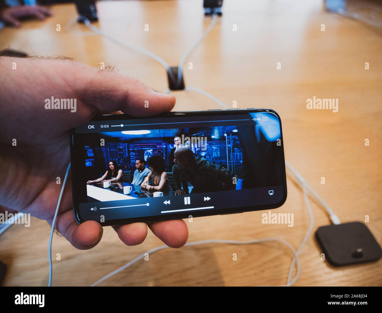 Paris, France - Nov 3, 2017: Customers admiring inside Apple Store the  latest professional iPhone XS smartphone manufactured by Apple Computers  showcasing a movie scene on the OLED display Stock Photo - Alamy