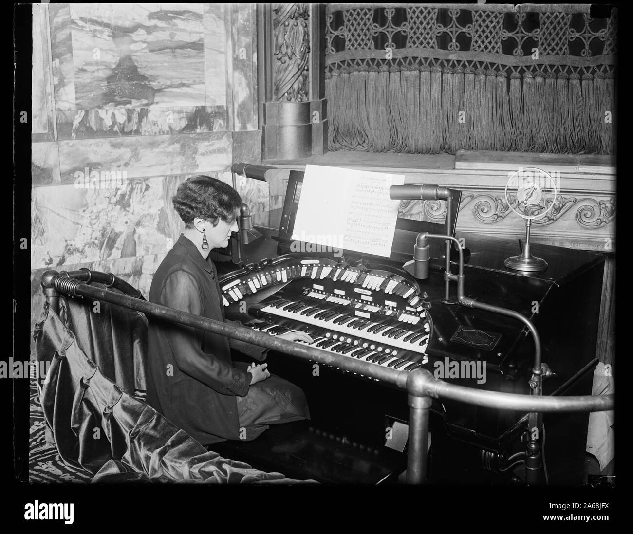 Woman playing organ Stock Photo