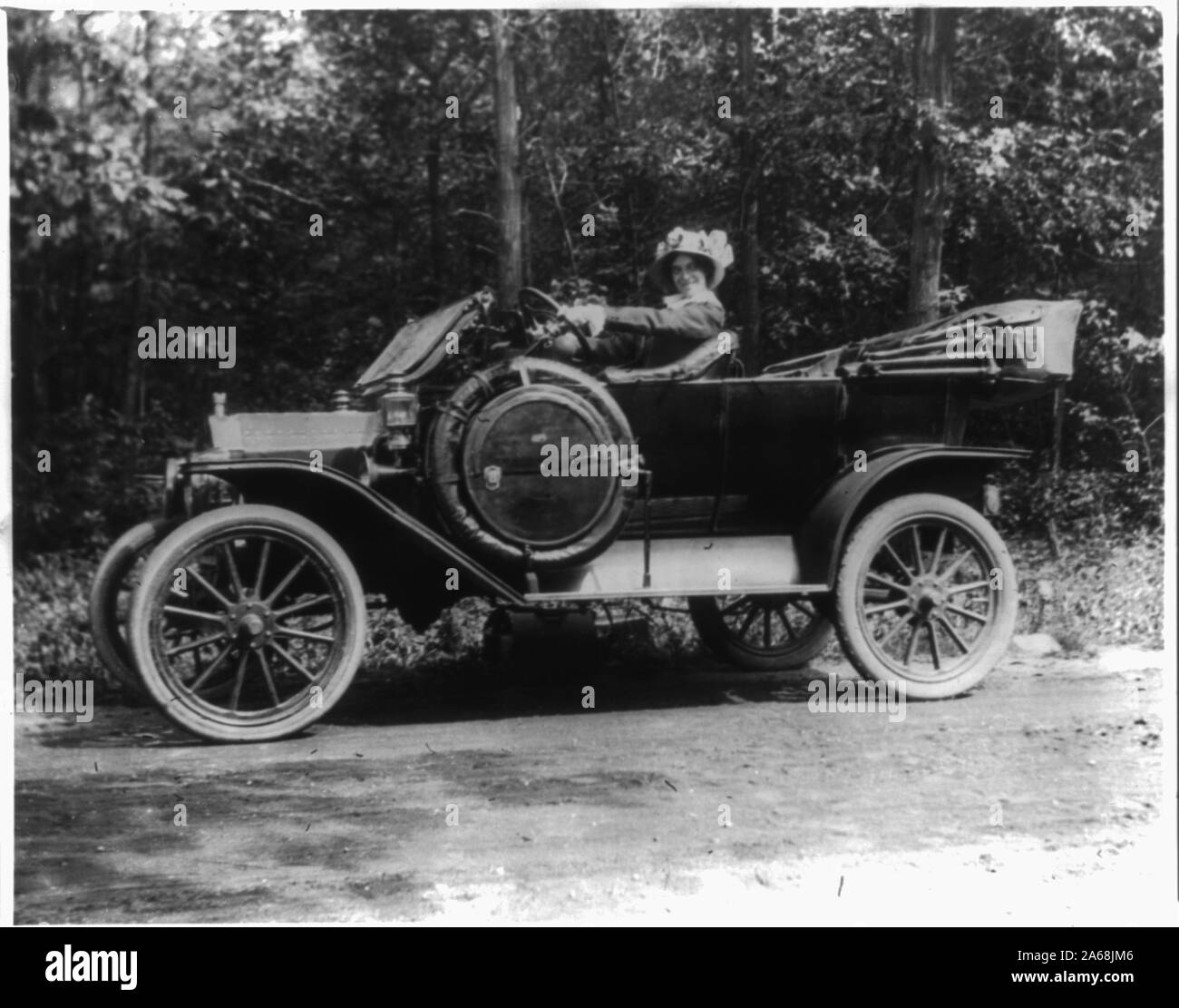 Woman seated at steering wheel hi-res stock photography and images - Alamy