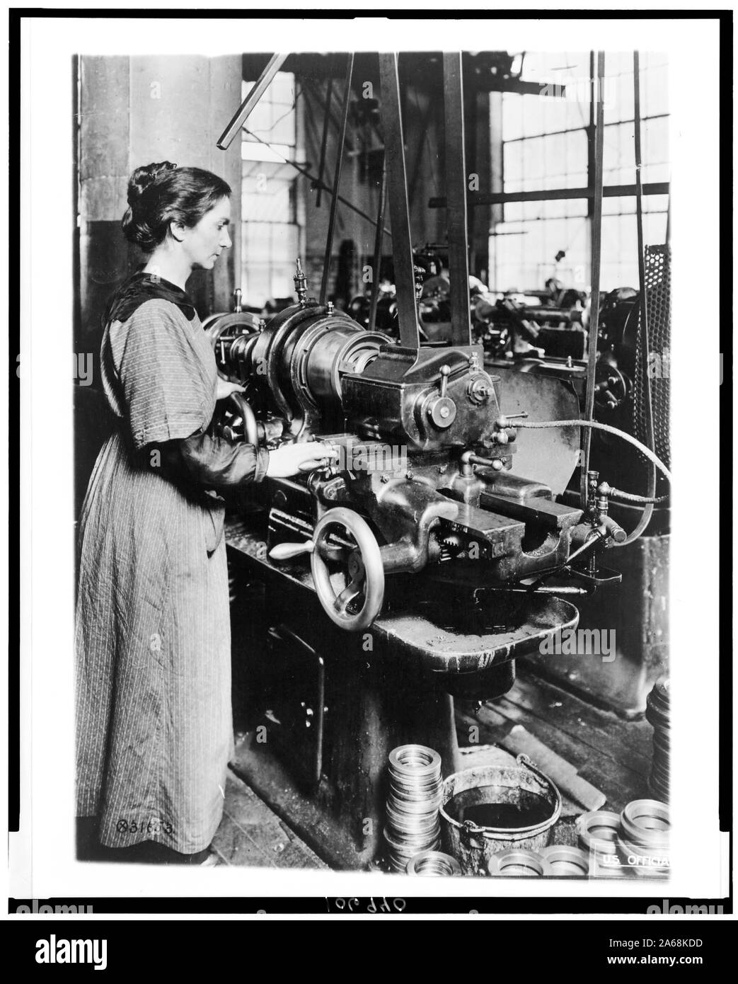 Woman working at internal thread milling machine, Norton Grinding Co ...