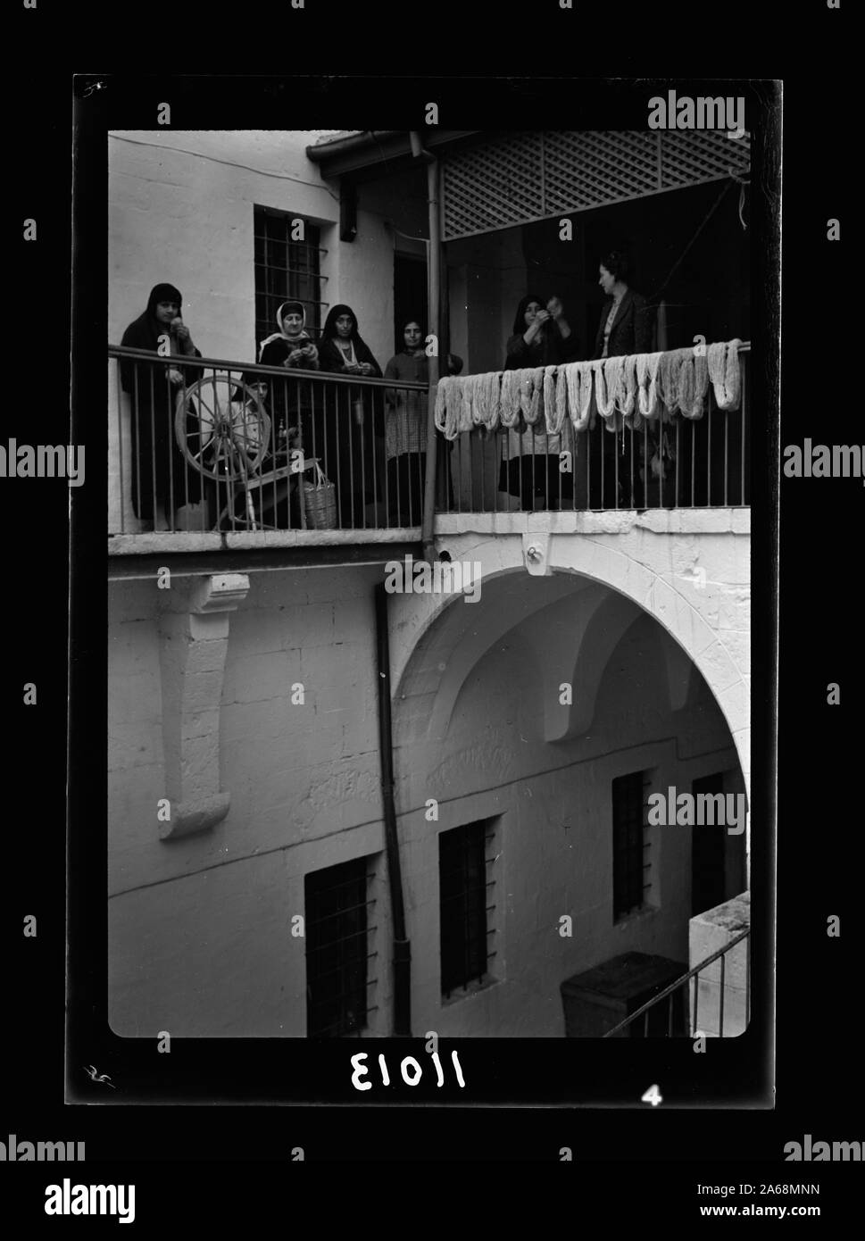 Women's Institute, Jerusalem. The courtyard, women spinning Stock Photo