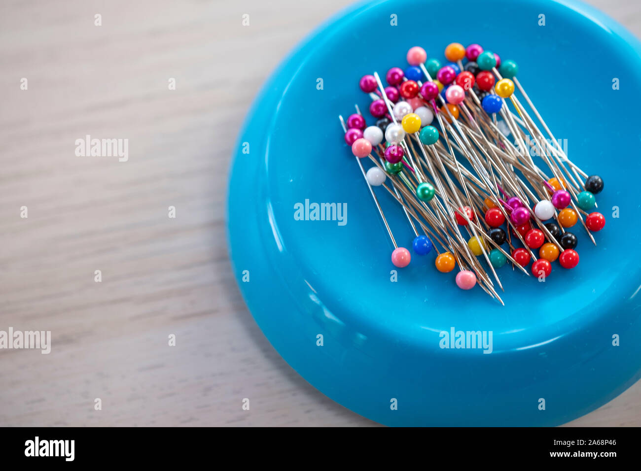 Dress making pins on a magnet Stock Photo - Alamy
