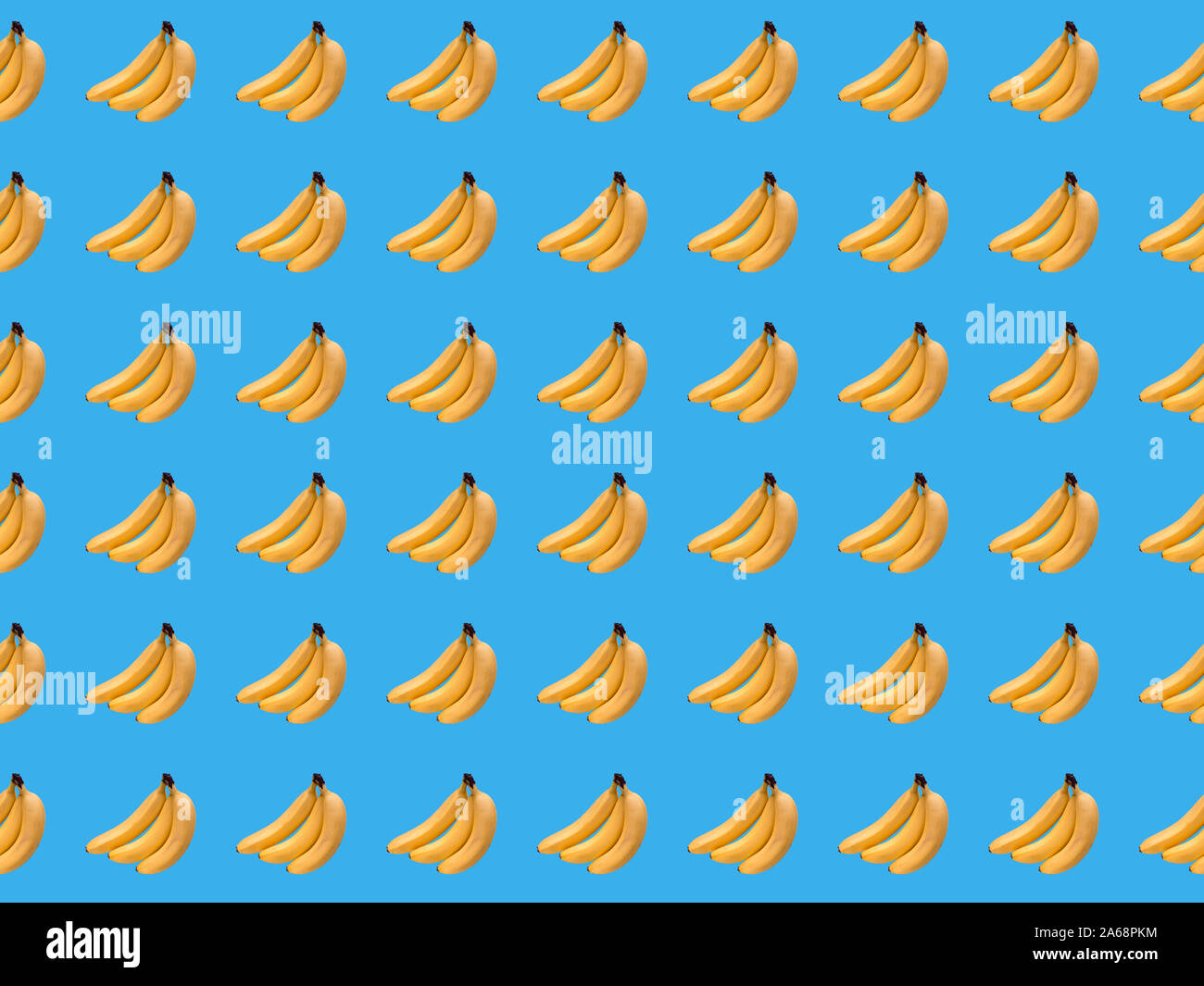 Digital seamless pattern with bananas  on light blue background. Repeating elements Stock Photo
