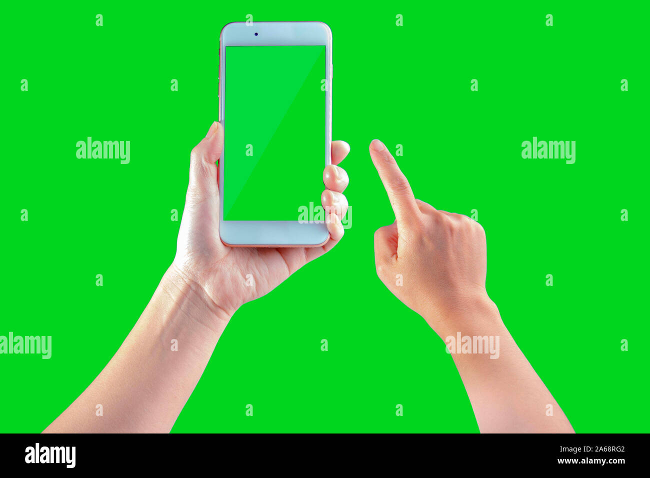 Smart phone hold by a woman on a green screen Stock Photo