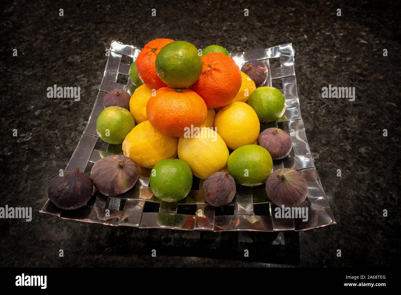 Mixed fruit and citrus in a home display dish hires stock photography