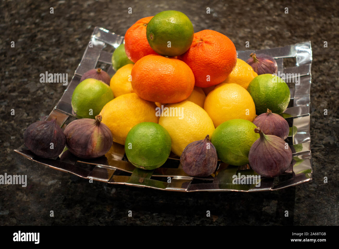 Mixed fruit and citrus in a home display dish hires stock photography