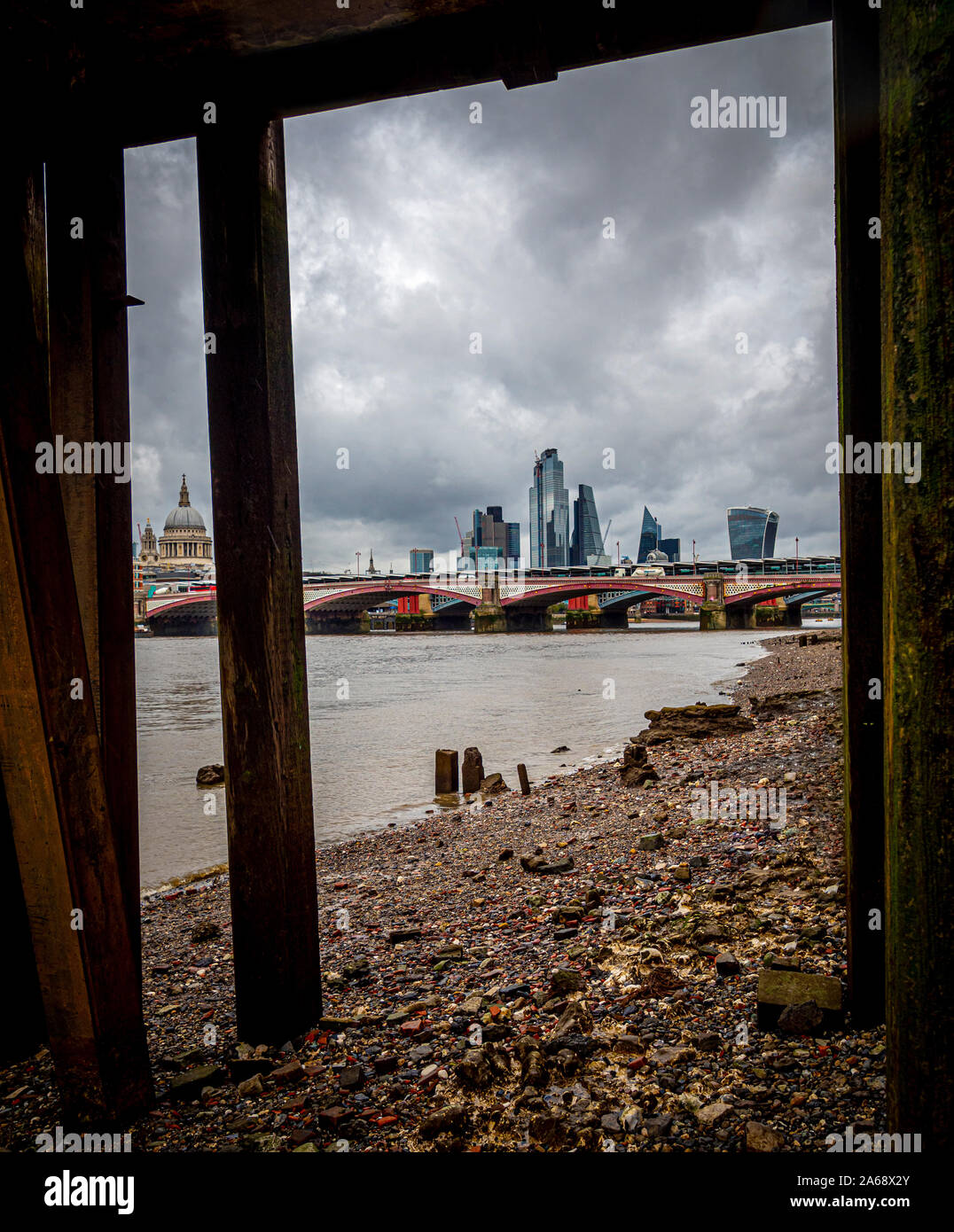 View under jetty at Oxo Tower Wharf towards St Pauls Cathedral and financial district of London, UK. Stock Photo