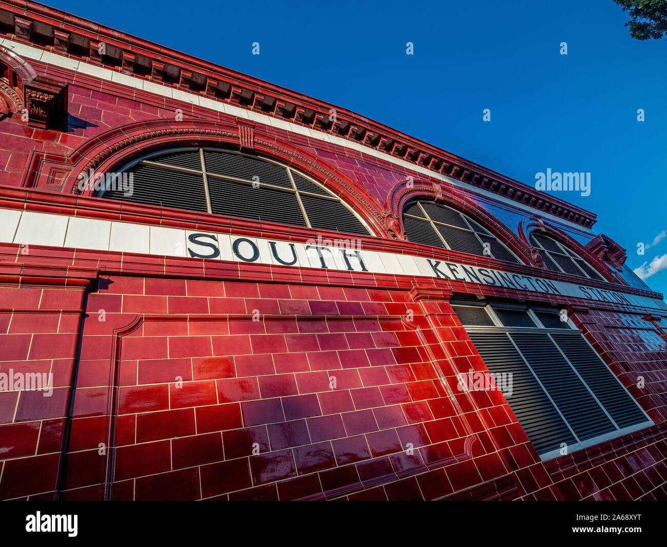 Red tiled exterior of South Kensington Tube Station, London, UK. Stock Photo
