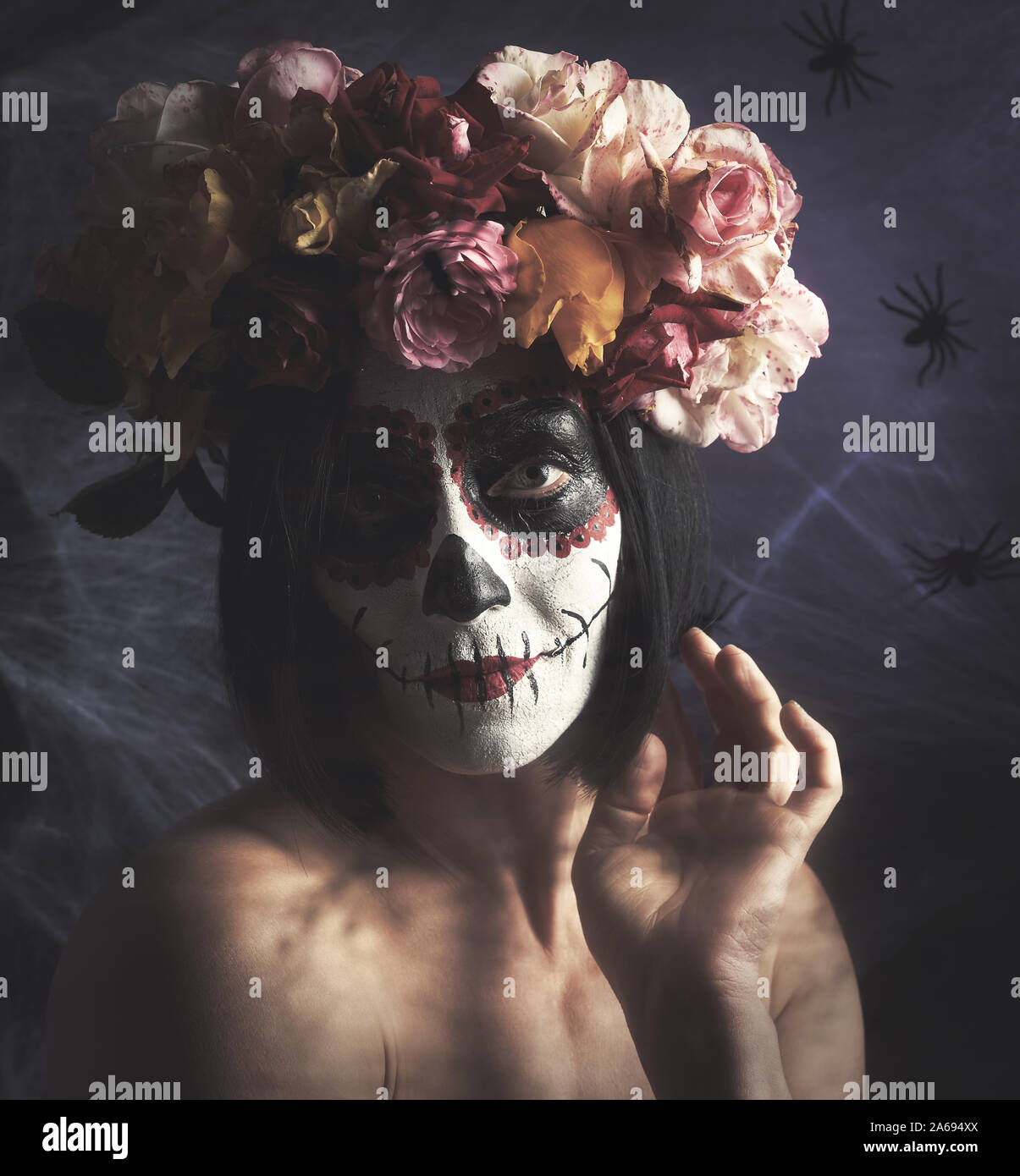 beautiful girl with traditional mexican death mask. Calavera Catrina. Sugar skull  makeup. girl dressed in a wreath of roses on a background of white w Stock  Photo - Alamy