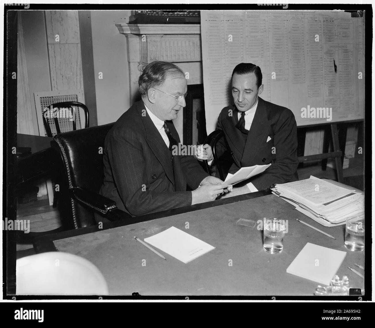 Young Ford blames ICC. Washington, D.C., Jan. 7. ICC order that all railroads use heavy equipment caused the Fords to sell the Detroit, Toledo, and Ironton Road in 1929, Edsel Ford, (right) President of the Ford Motor Co., told Chairman Burton K. Wheeler of the Senate rail inquiry today Stock Photo
