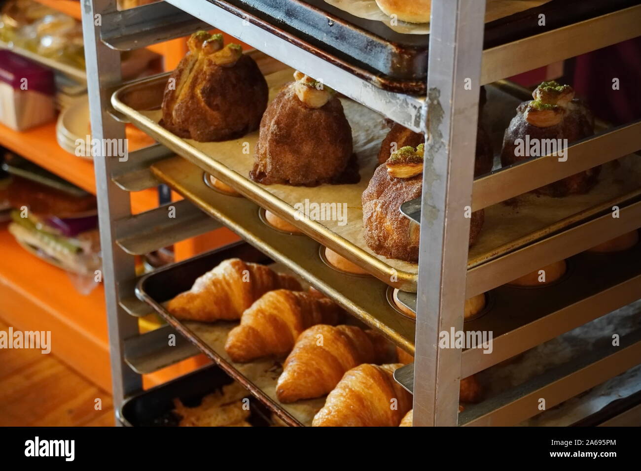 Boothbay Harbor, ME / USA - October 20, 2019: Delicious rolls and various breads in a sheet pan rack Stock Photo