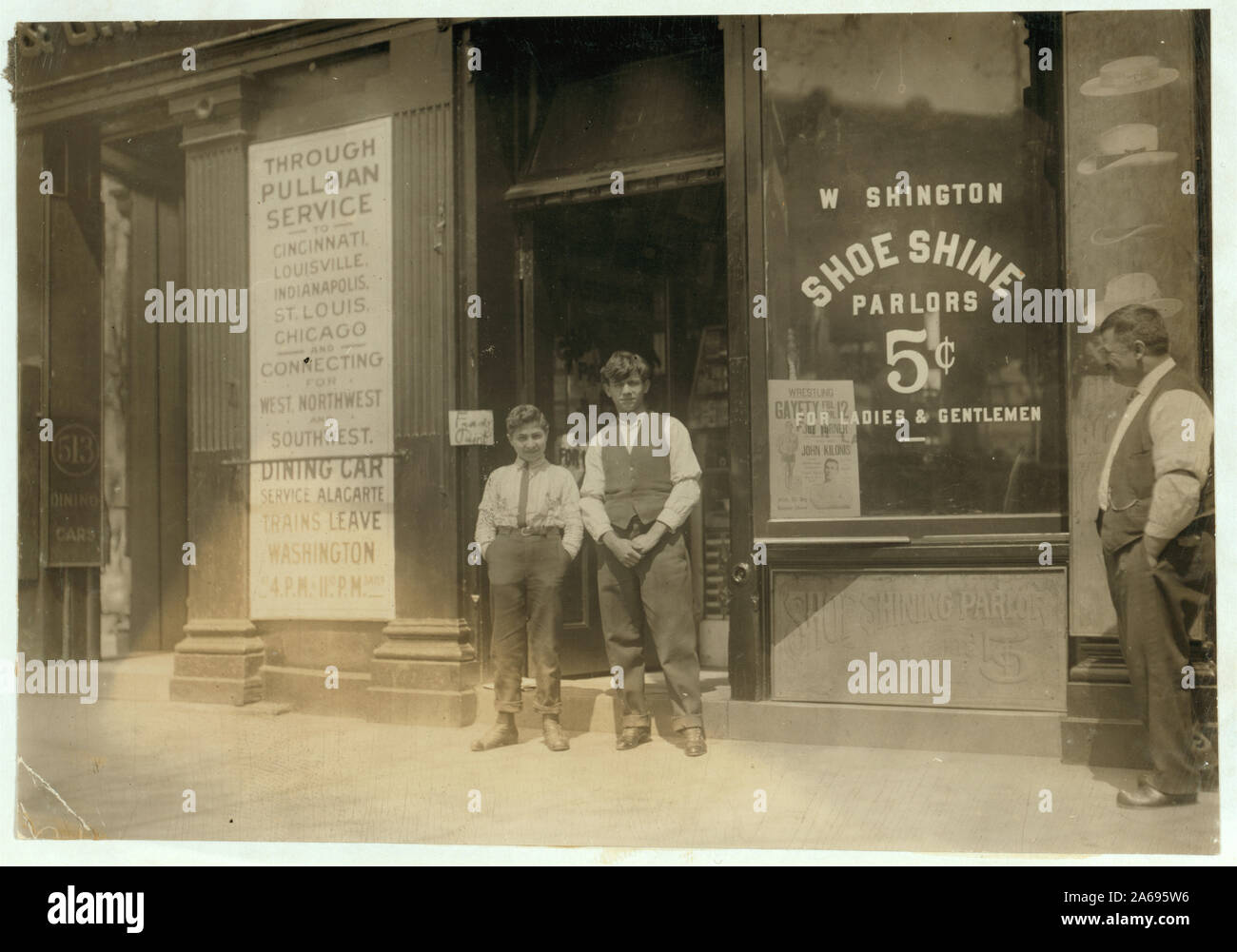 Young boy is Ciriakos Keiradimos, a young Greek shoe-shiner, working in shop at 511 Penn. Ave., N.W., Washington, D.C. Said to be 16 yrs. old, but is absolutely illiterate. Has been in this country only 2 months. Works until 9 P.M. every day and until 11 P.M. Saturdays. Abstract: Photographs from the records of the National Child Labor Committee (U.S.) Stock Photo