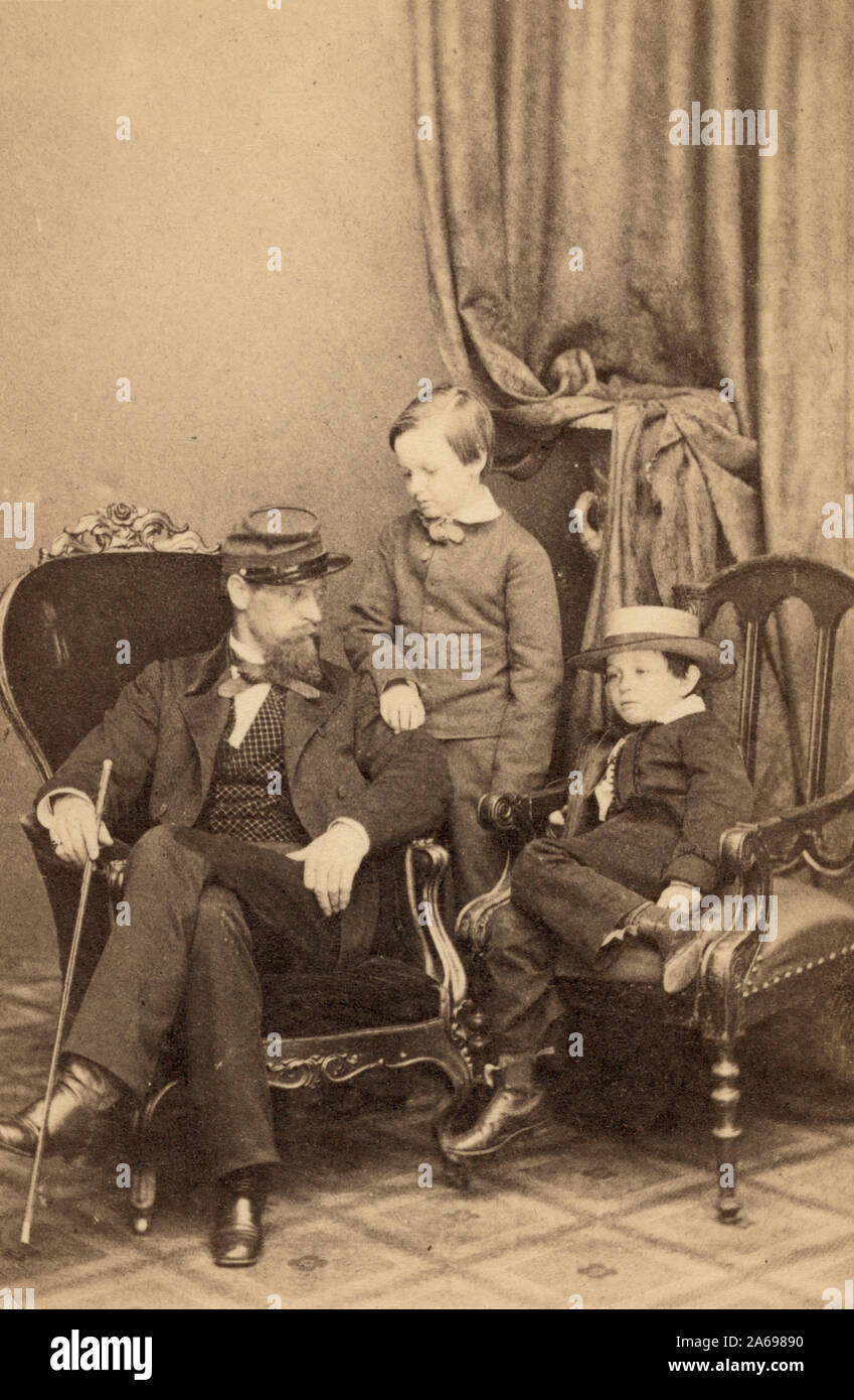 Willie and Tad Lincoln with their mother's nephew, Lockwood Todd, in Mathew Brady's studio, January 1, 1861 Stock Photo
