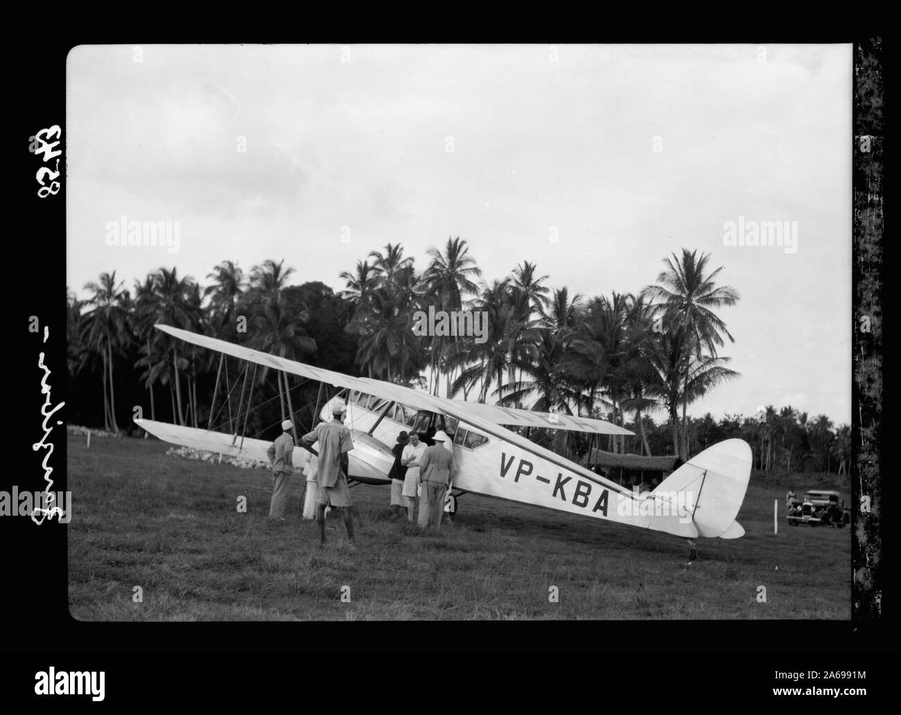 Zanzibar. Plane alighting. Grounds surrounded by dense palm groves