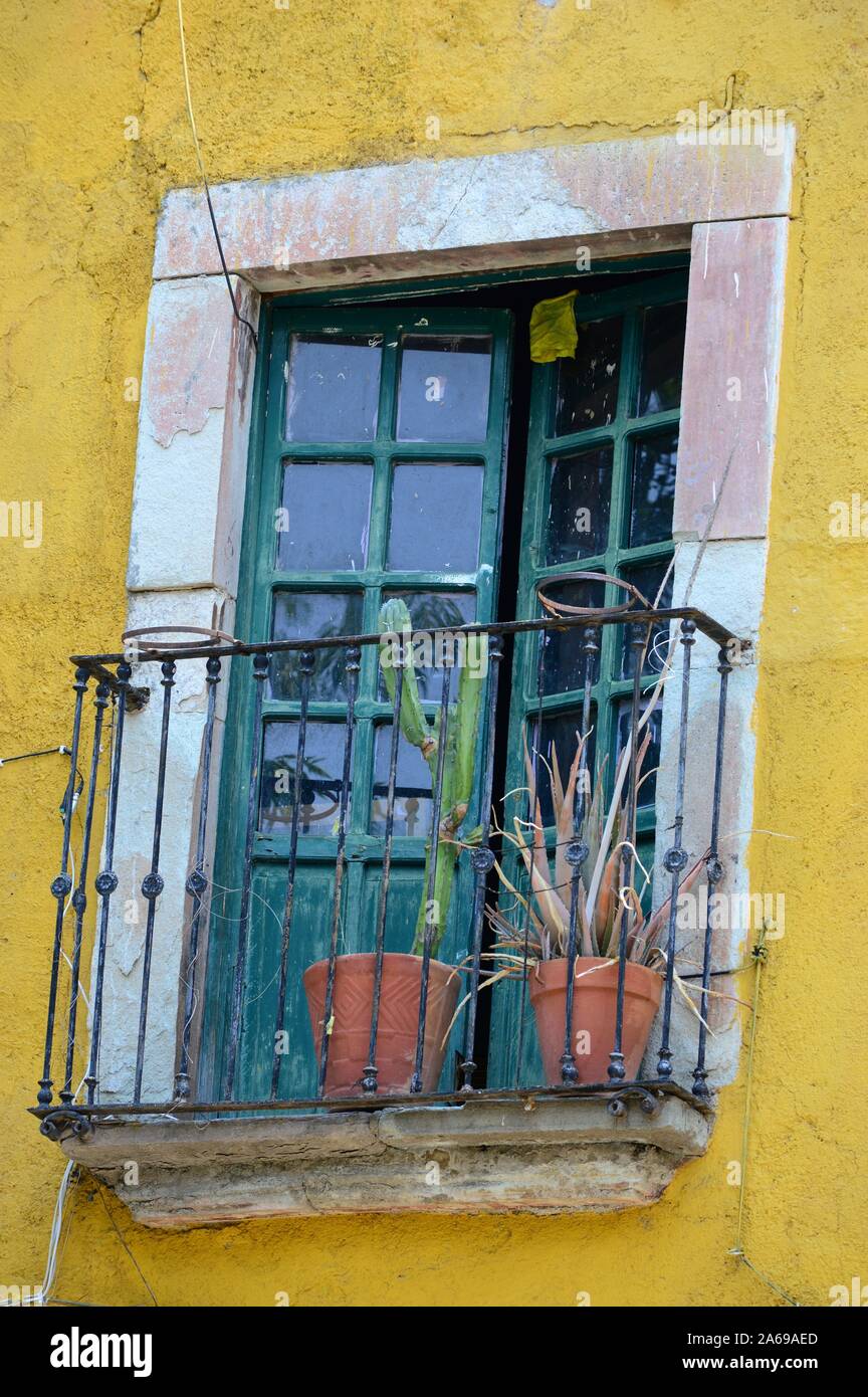 Yellow Spanish Colonial Window in Guanajuato, Mexico Stock Photo