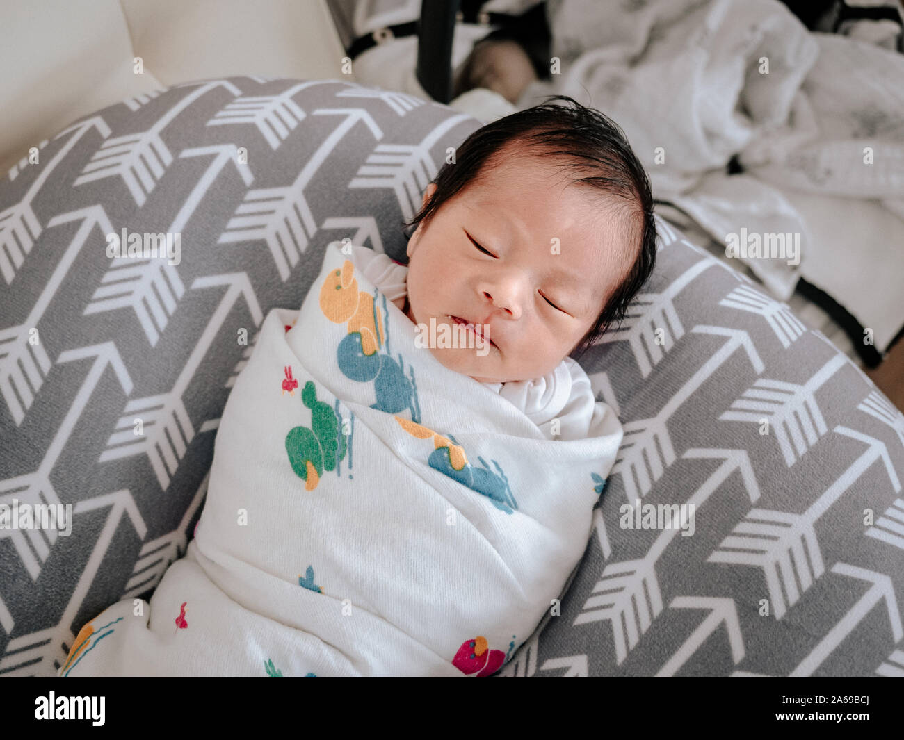 Newborn sleeping on nursing pillow sales