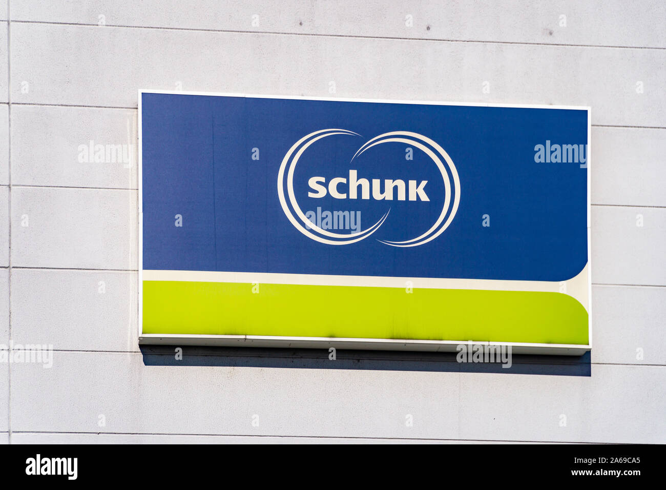 GIESSEN HEUCHELHEIM, GERMANY - August, 2019: Schunk logo sign on the wall Stock Photo