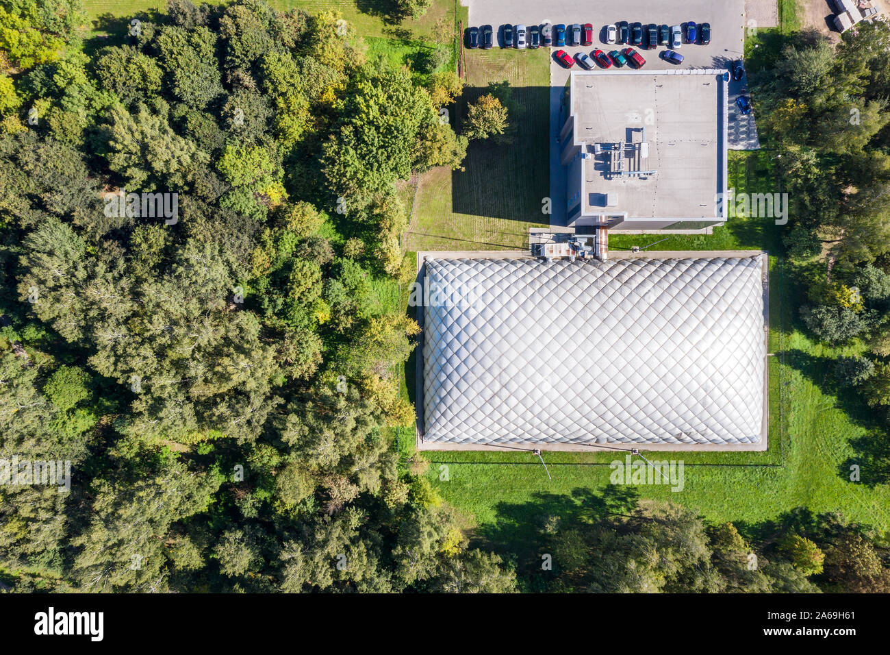 top down view of inflatable tennis court in green summer park. aerial image Stock Photo