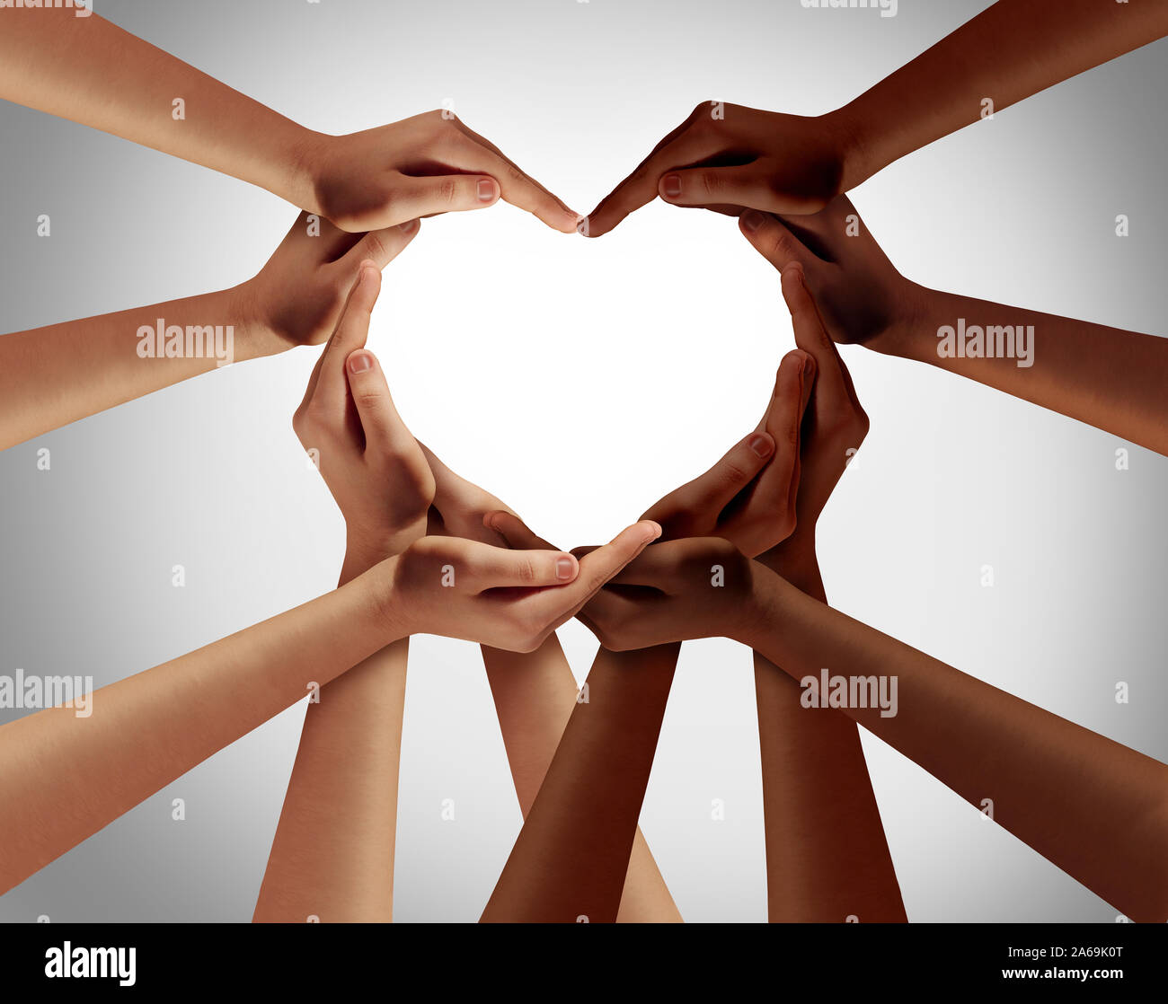 Racial love with white caucasion and black african american hands shaped as an interracial racism society, heart representing world unity and ethnic. Stock Photo