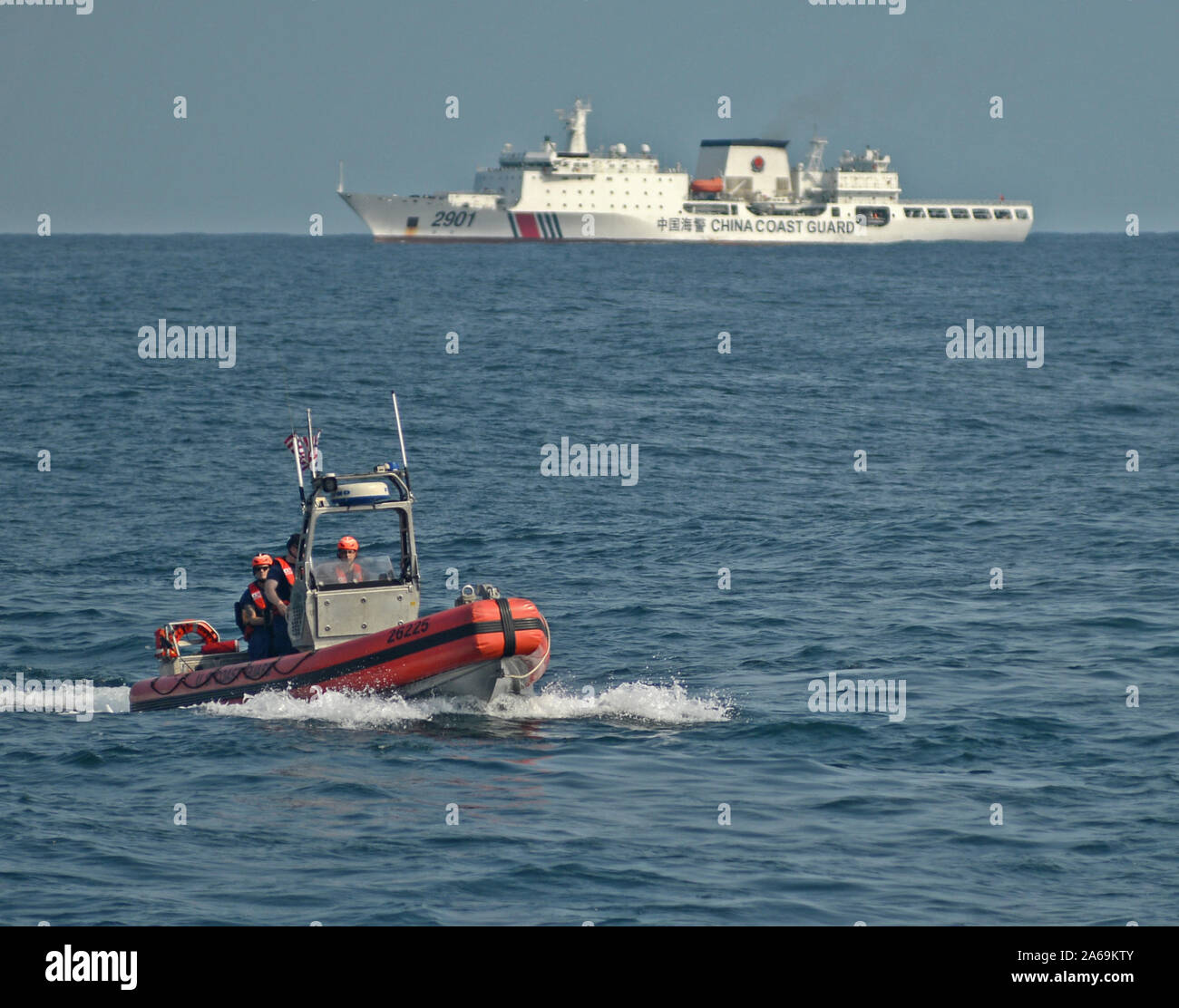 A small boat crew from Coast Guard Cutter Stratton conducts operations in the Yellow Sea Oct. 6, 2019, with a China Coast Guard cutter on the horizon. The Stratton was on a United Nations Security Council Relations patrol as a part of the United States’ ongoing contribution to international efforts in combatting Democratic People's Republic of Korea (DPRK)’s maritime sanctions evasion activity. U.S. Coast Guard photo by PA1 Nate Littlejohn Stock Photo