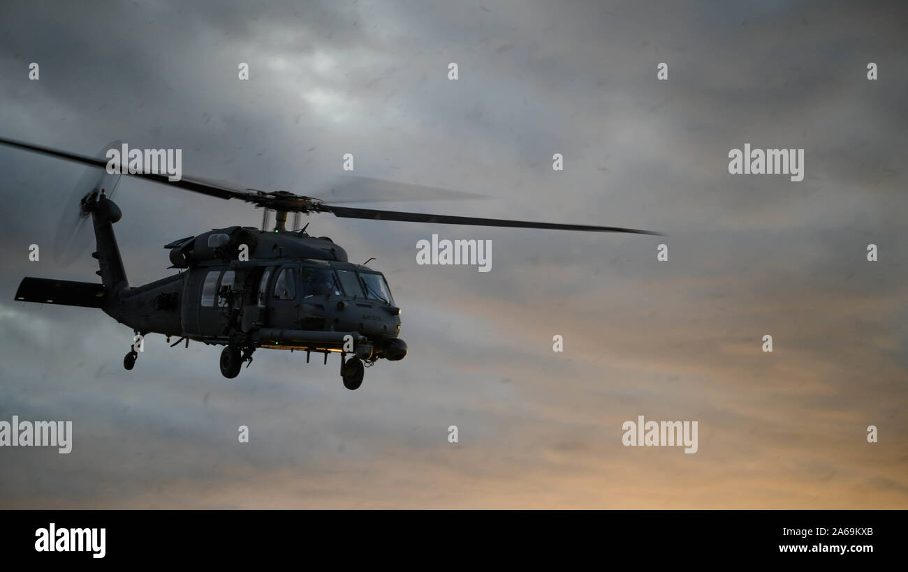 A U.S. Air Force HH-60 Pave Hawk with 31st and 33rd Rescue Squadron, lands on the airfield during exercise Beverly High 20-1 at Ie Shima airfield, Japan on Oct. 21, 2019. The exercise was an integration of Marines and Airmen designed to rehearse combat employment of rescue forces to an austere location and establish communications in any environment. (U.S. Marine Corps photo by Cpl. Kallahan Morris) Stock Photo