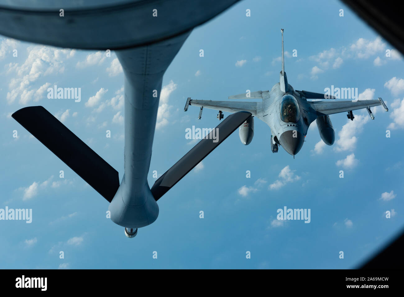 A Republic of Korea Air Force F-16D Fighting Falcon prepares to refuel with a KC-135 Stratotanker from the 909th Air Refueling Squadron during a training exercise Oct. 8, 2019. The 909th ARS from Kadena Air Base trained with the ROKAF Falcons to deepen interoperability, enhancing joint lethality to maintain peace in a contested environment. The United States and Republic of Korea continue to build a comprehensive strategic alliance of bilateral, regional, and global scope based on common values and mutual trust. This alliance will strengthen the combined defense posture on the Korean Peninsula Stock Photo