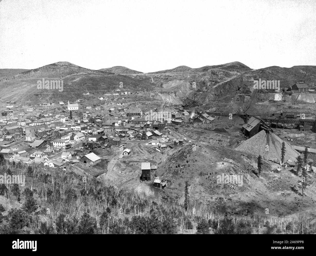 Distant view of mining town; hills in background. Stock Photo