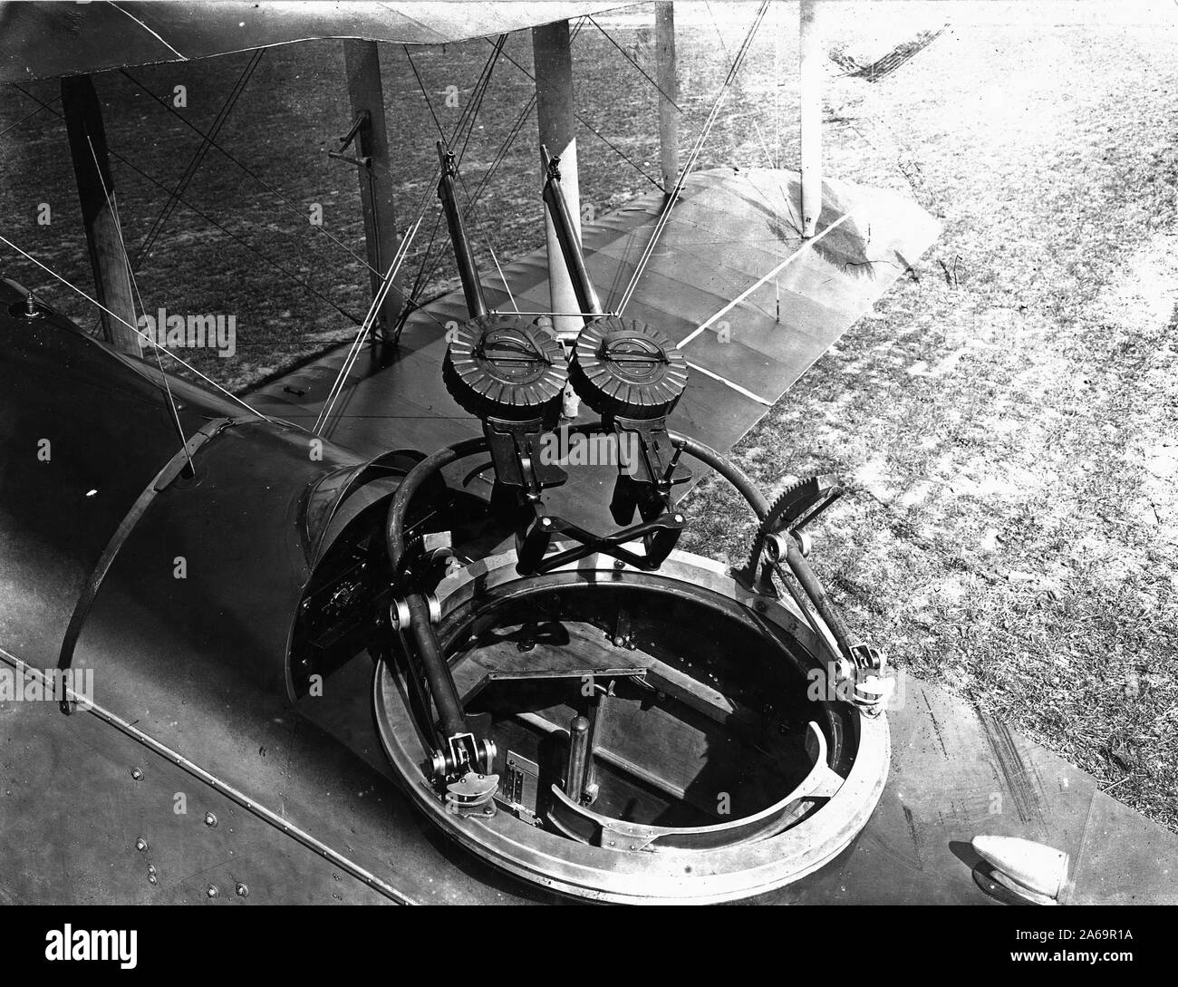 View of De Haviland plane from left rear quarter, looking into gunner's cockpit. Twin mounting of Lewis guns. Venturi air speed gauge mounted on wing strut 1918 Stock Photo
