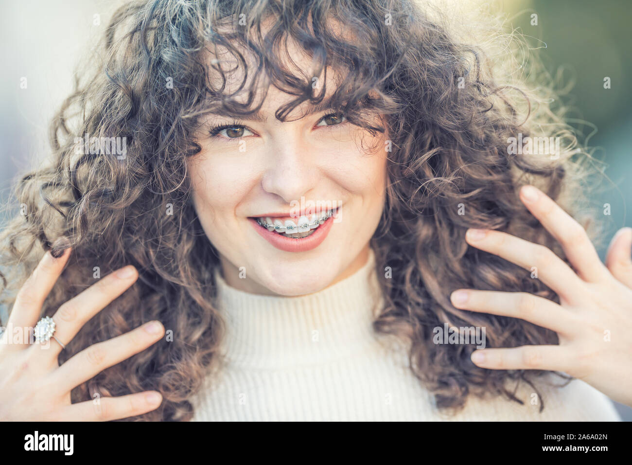 Portrait Of A Happy Smiling Young Woman With Dental Braces And And