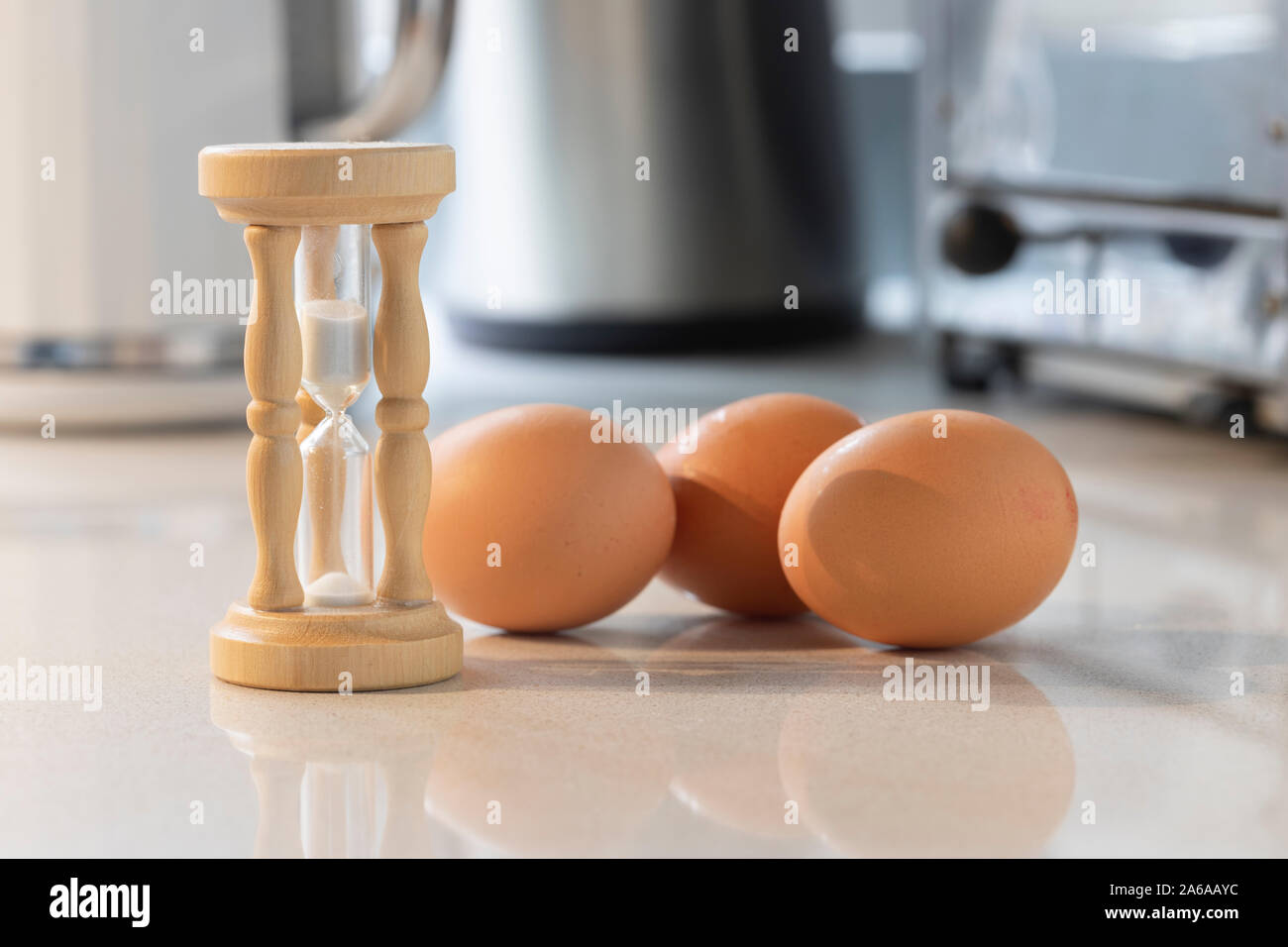 An egg timer with eggs Stock Photo