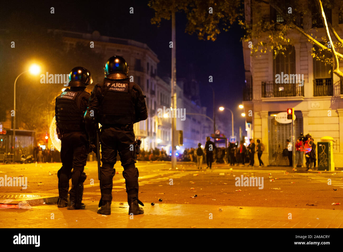 Barcelona, Spain - 18 october 2019: mossos d'esquadra in urquinaona square catalan police with guns confront with protesters at night during clashes w Stock Photo
