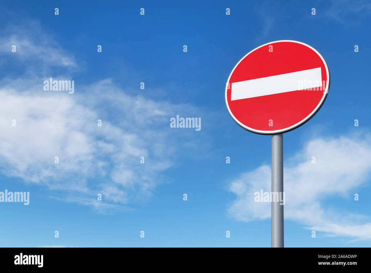 No entry for vehicular traffic. Road sign against blue sky. Space for ...