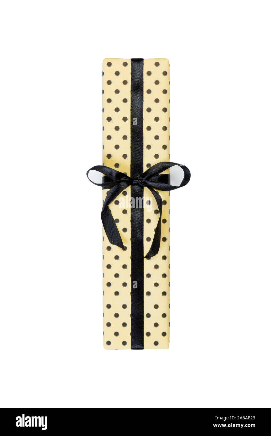 Premium Photo  Black gift with a beige ribbon on a yellow background. view  from above.