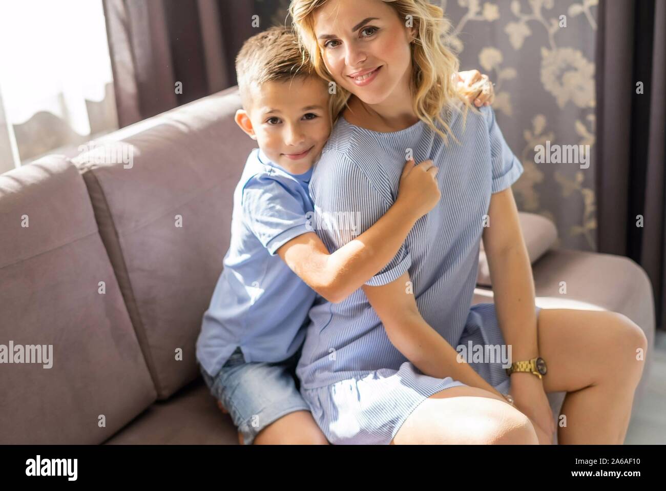 Happy mum with son at home. Stock Photo