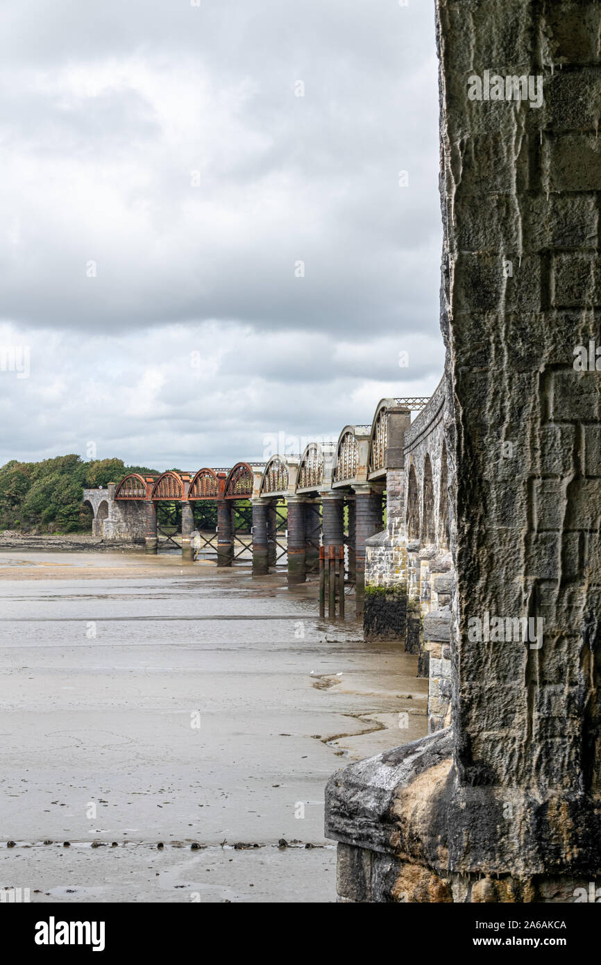 Mud flats underneath the railway bridge crossing the River Tavy at low ...