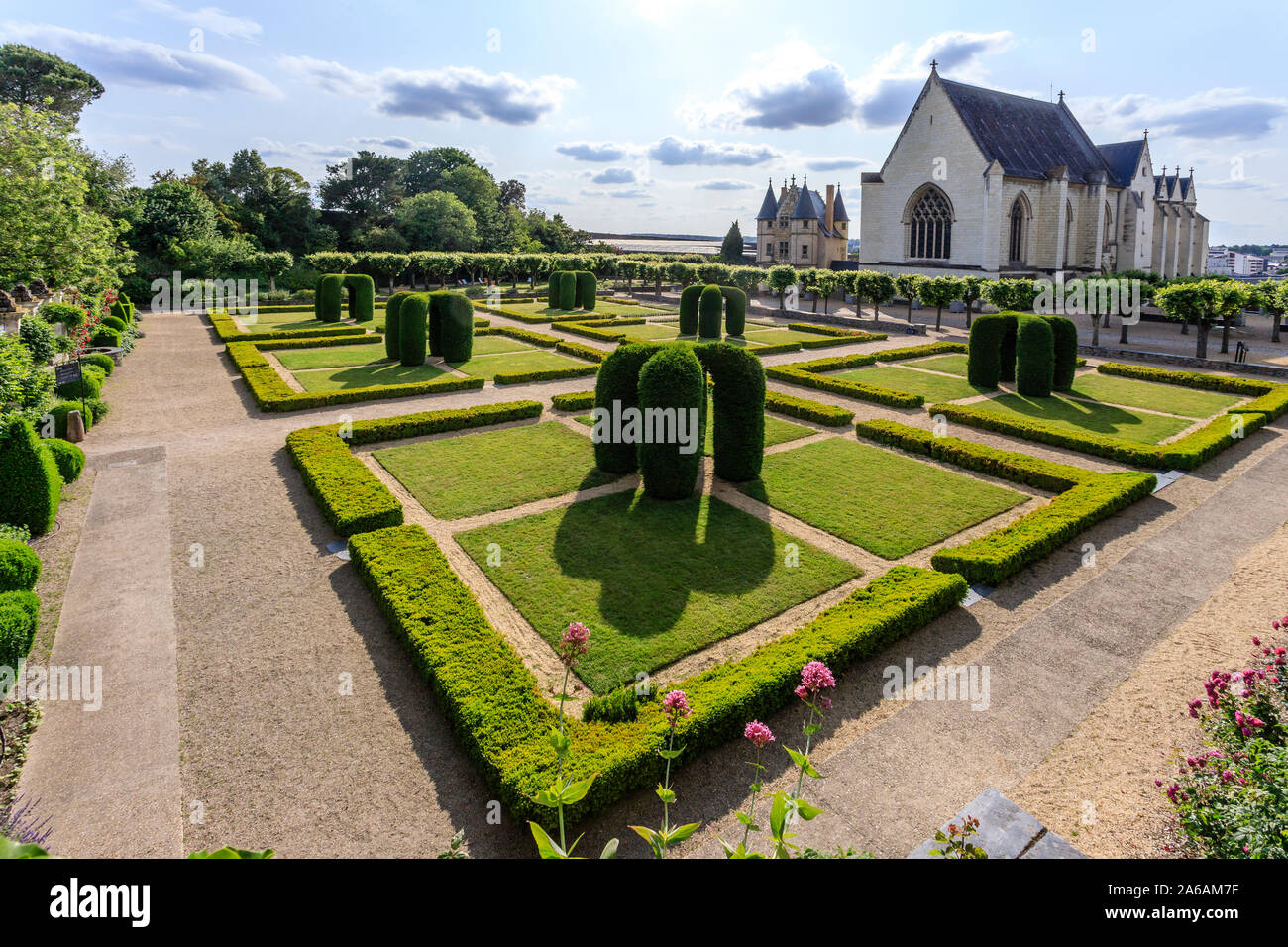 France, Maine et Loire, Angers, Chateau d’Angers, Angers castle, in the main courtyard, the chapel and the Regular garden with arches of carved yews a Stock Photo