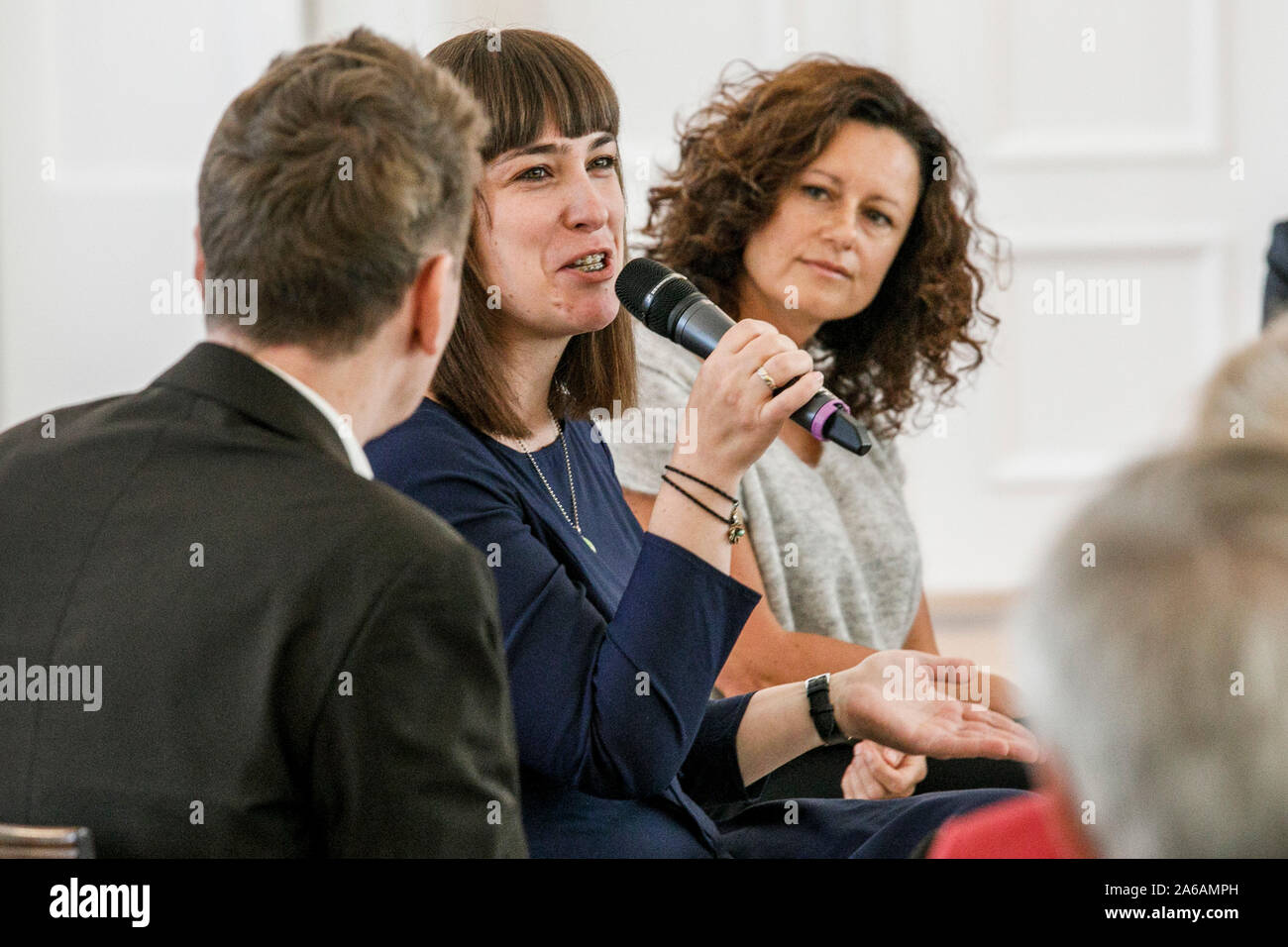 Berlin, Germany. 25th Oct, 2019. Stephanie Auras-Lehmann (M), founder of the welcome agency 'Comeback Elbe-Elster', and Jana Simon (r), writer, take part in another event of the Federal President's series of talks 'Geteilte Geschichte(n)' (Shared Stories) at Schloss Bellevue. Credit: Carsten Koall/dpa/Alamy Live News Stock Photo
