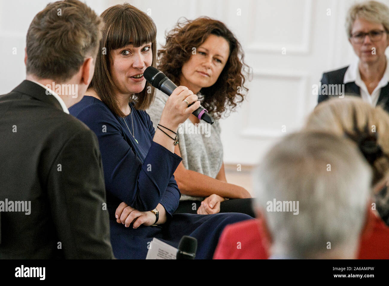 Berlin, Germany. 25th Oct, 2019. Stephanie Auras-Lehmann (2nd from left), founder of the welcome agency 'Comeback Elbe-Elster', and Jana Simon (2nd from right), writer, take part in another event of the Federal President's discussion series 'Geteilte Geschichte(n)' (Shared Stories) at Bellevue Castle. Credit: Carsten Koall/dpa/Alamy Live News Stock Photo
