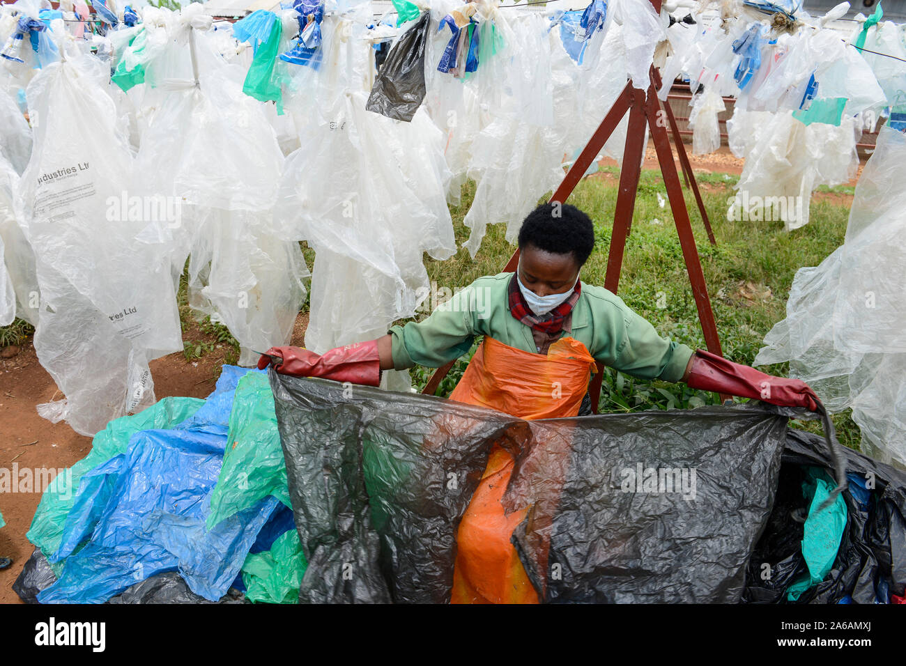 RWANDA, Kigali, plastic recycling at company ecoplastics, worker clean and  dry plastic foils before processing to granulate which is used for new  plastic products - plastic ban Stock Photo - Alamy