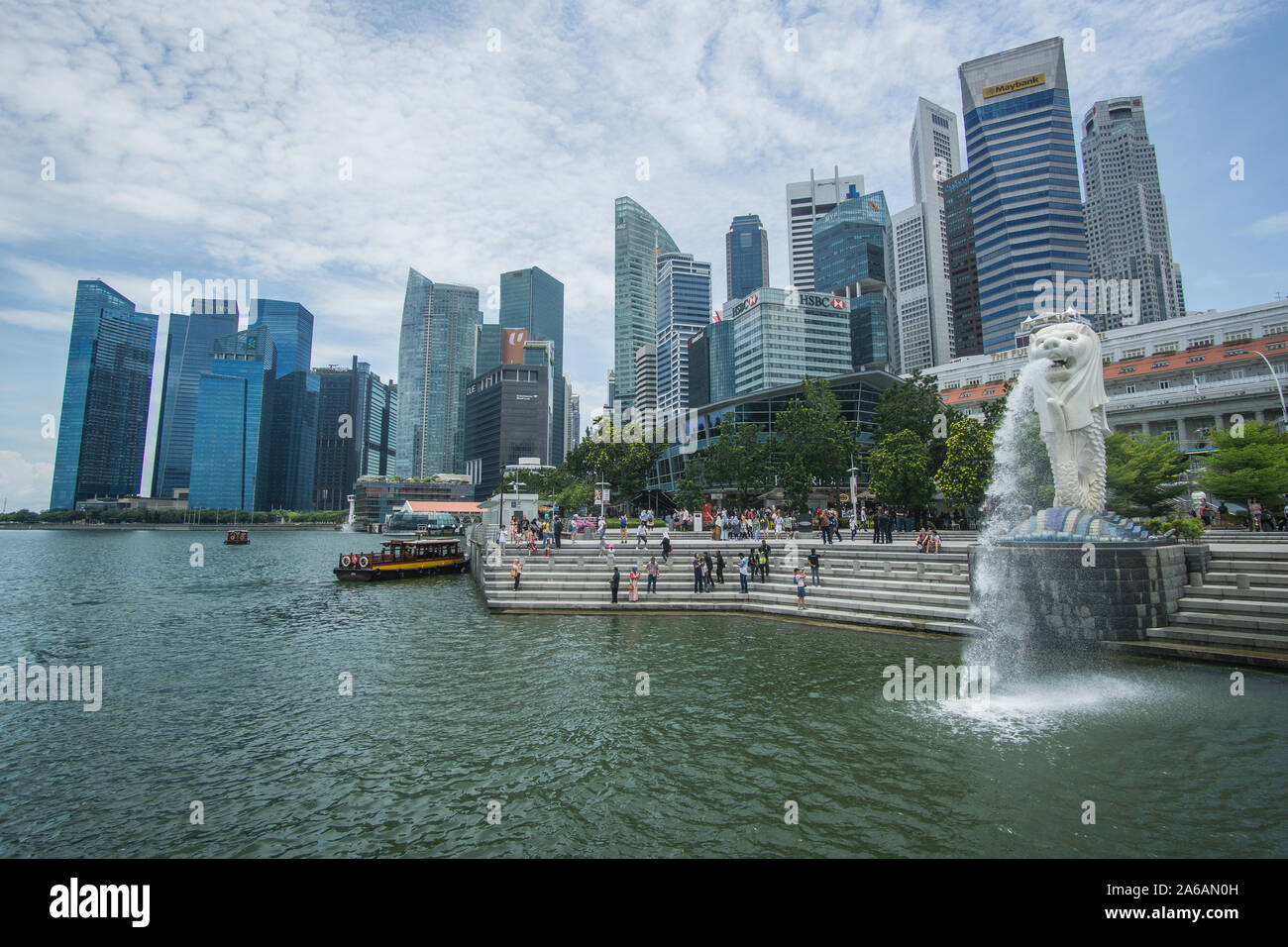 The Merlion statue in a beautiful day around the Marina bay in ...