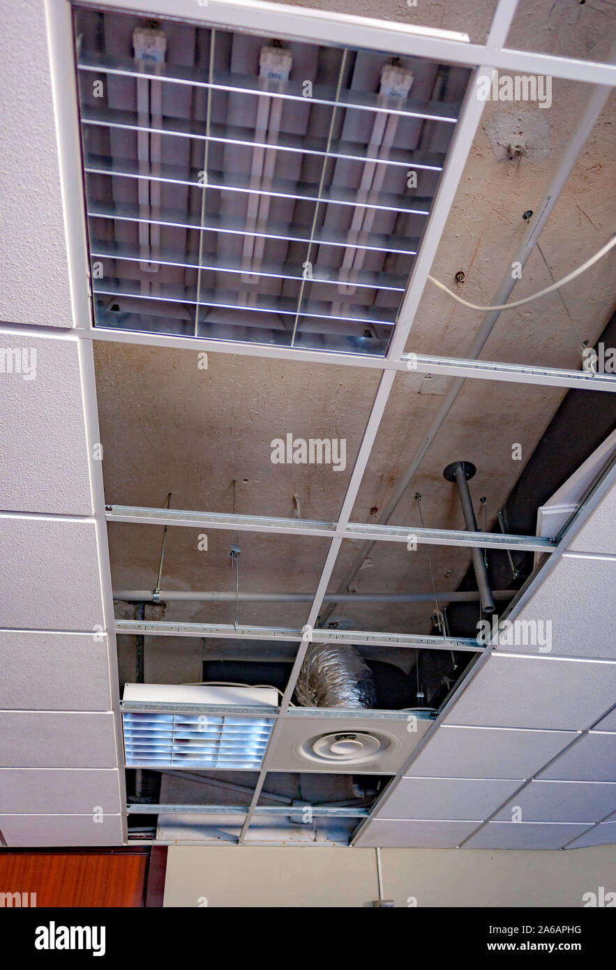repairing board ceiling with gypsum. In the classroom Stock Photo