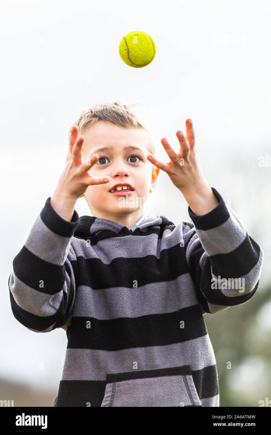 Man catching a tennis ball hires stock photography and images Alamy