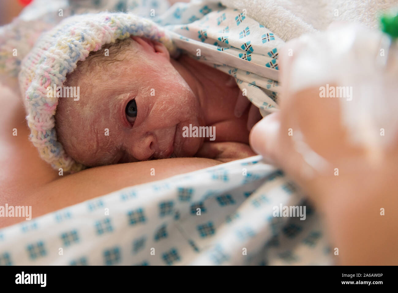 A young baby girl is born premature weighing just 4lbs, pictured here ...