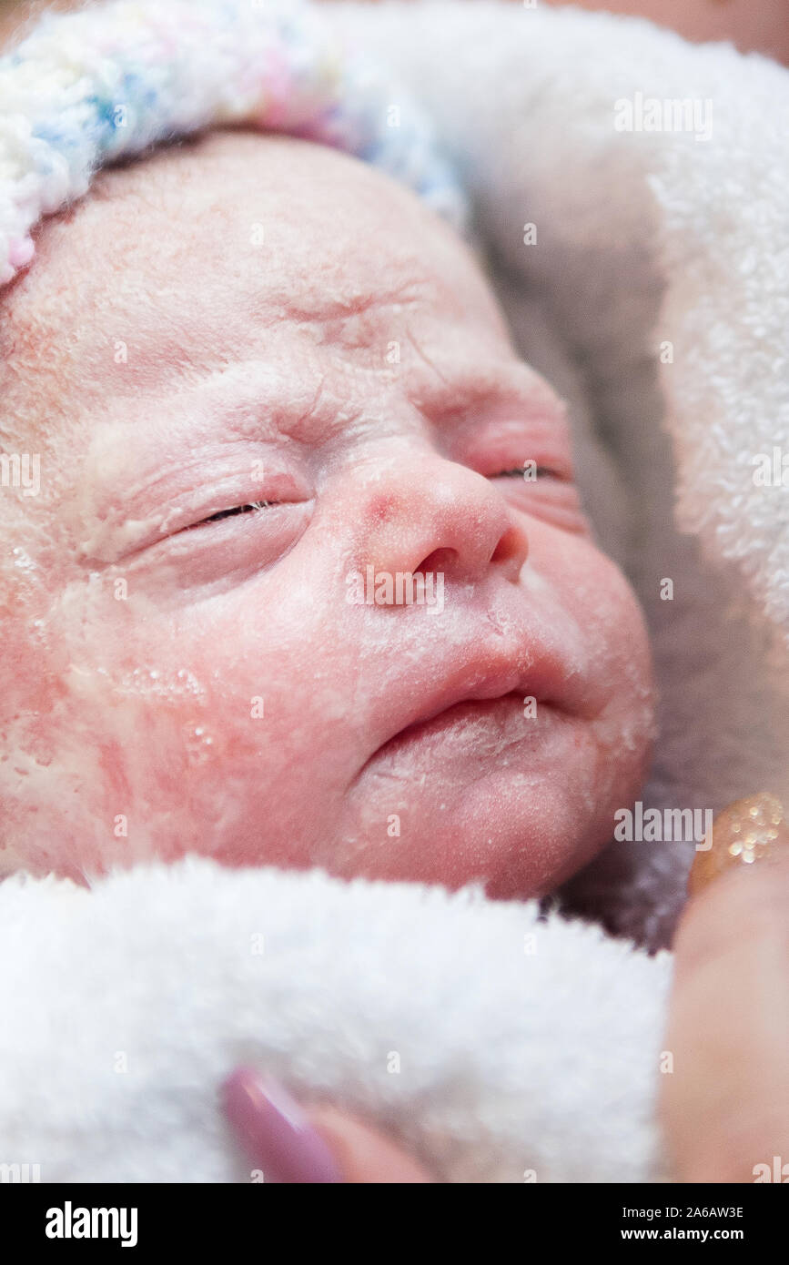 A young baby girl is born premature weighing just 4lbs, pictured here ...