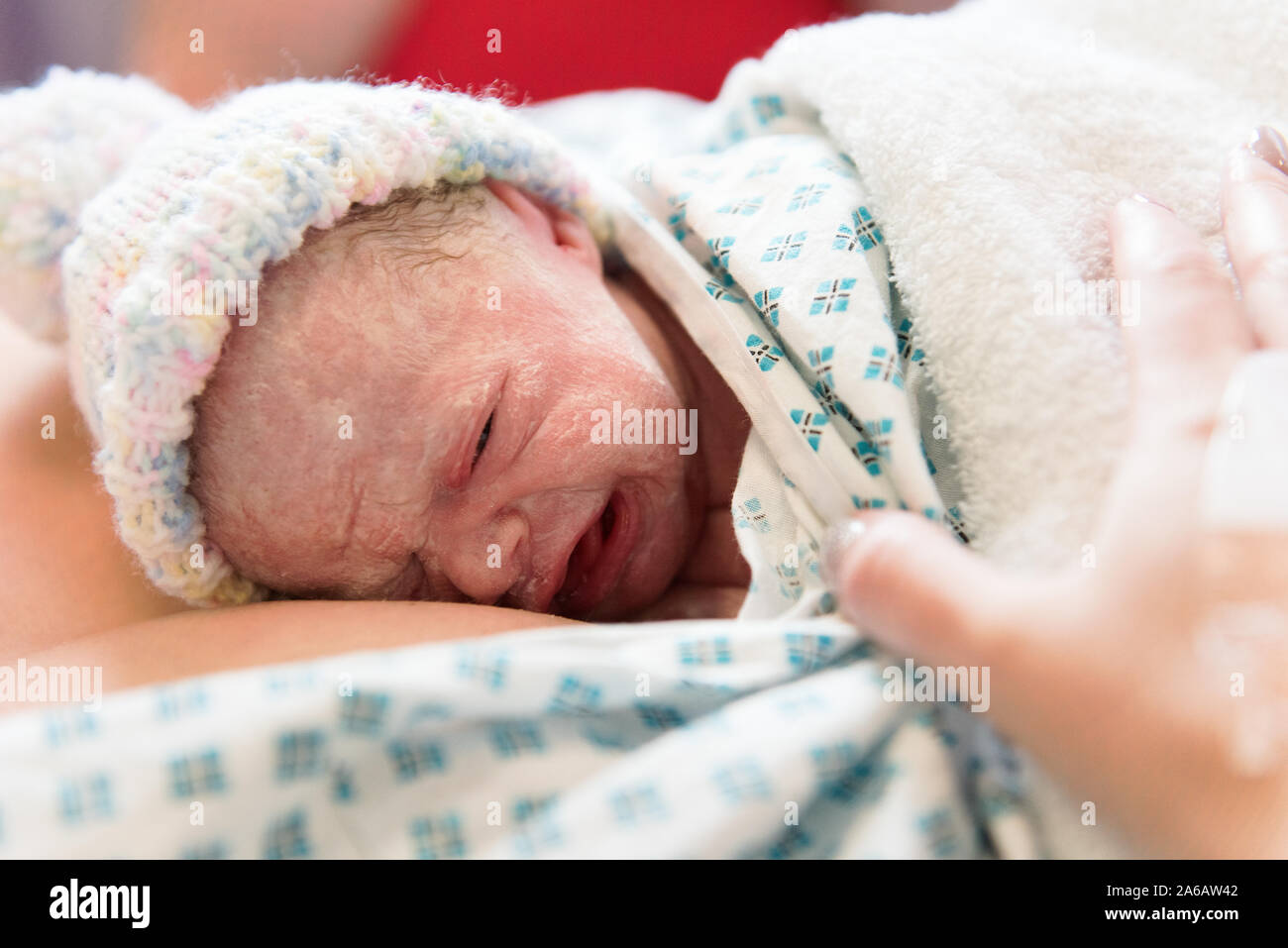 A young baby girl is born premature weighing just 4lbs, pictured here ...