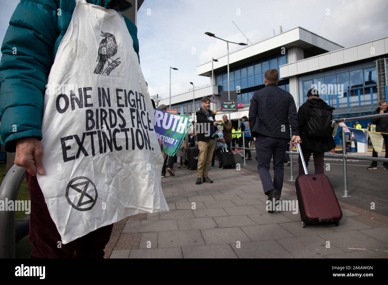 Extinction Rebellion disruption outside City Airport on 10th October 2019 in London, England, United Kingdom. The protest is against the climate and pollution impact of the government’s plans for airport expansion which will potentially double the amount of flights coming from City Airport. Extinction Rebellion is a climate change group started in 2018 and has gained a huge following of people committed to peaceful protests. These protests are highlighting that the government is not doing enough to avoid catastrophic climate change and to demand the government take radical action to save the p Stock Photo