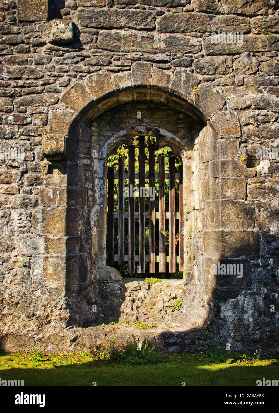 A gated window gives the impression of a portcullis at Walley Abbey, Lancashire, UK Stock Photo